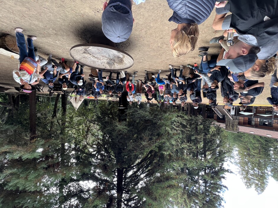 Circle of founders sitting around a fire pit during an unconference session