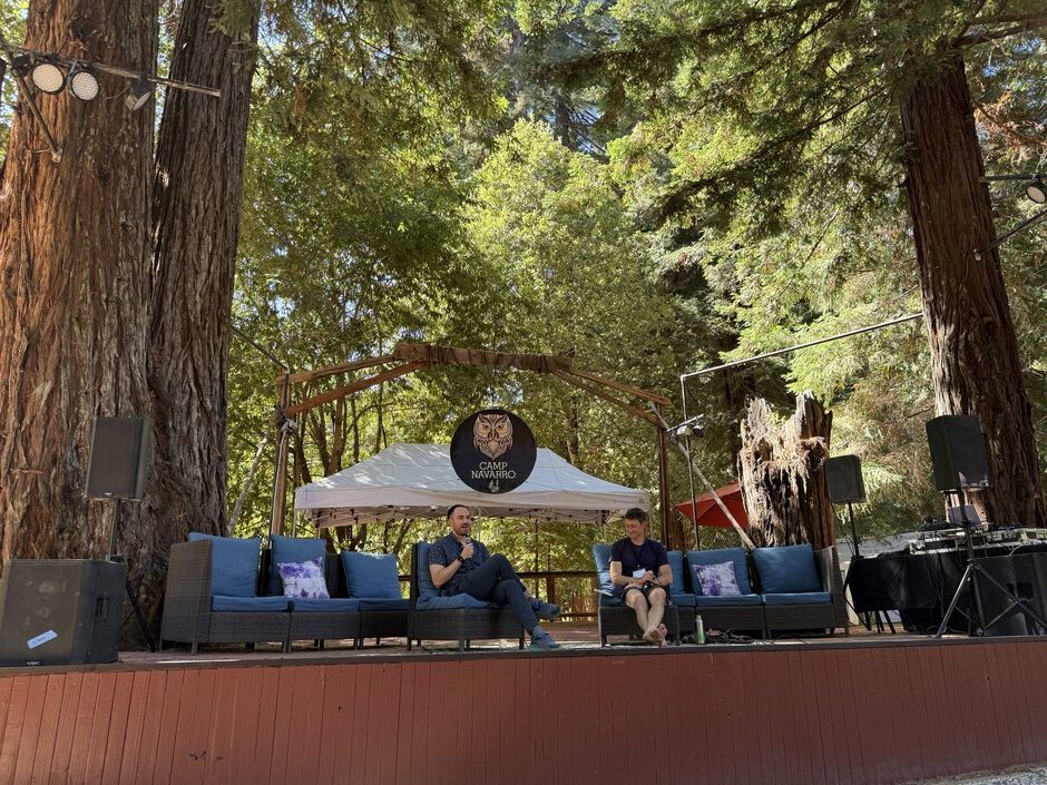 Max Mullen keynote fireside chat on the outdoor Camp Navarro stage under redwoods